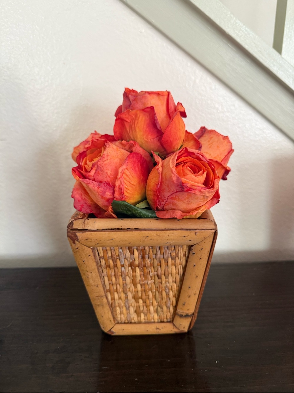 Vibrant Orange Rose Bouquet in Woven Planter